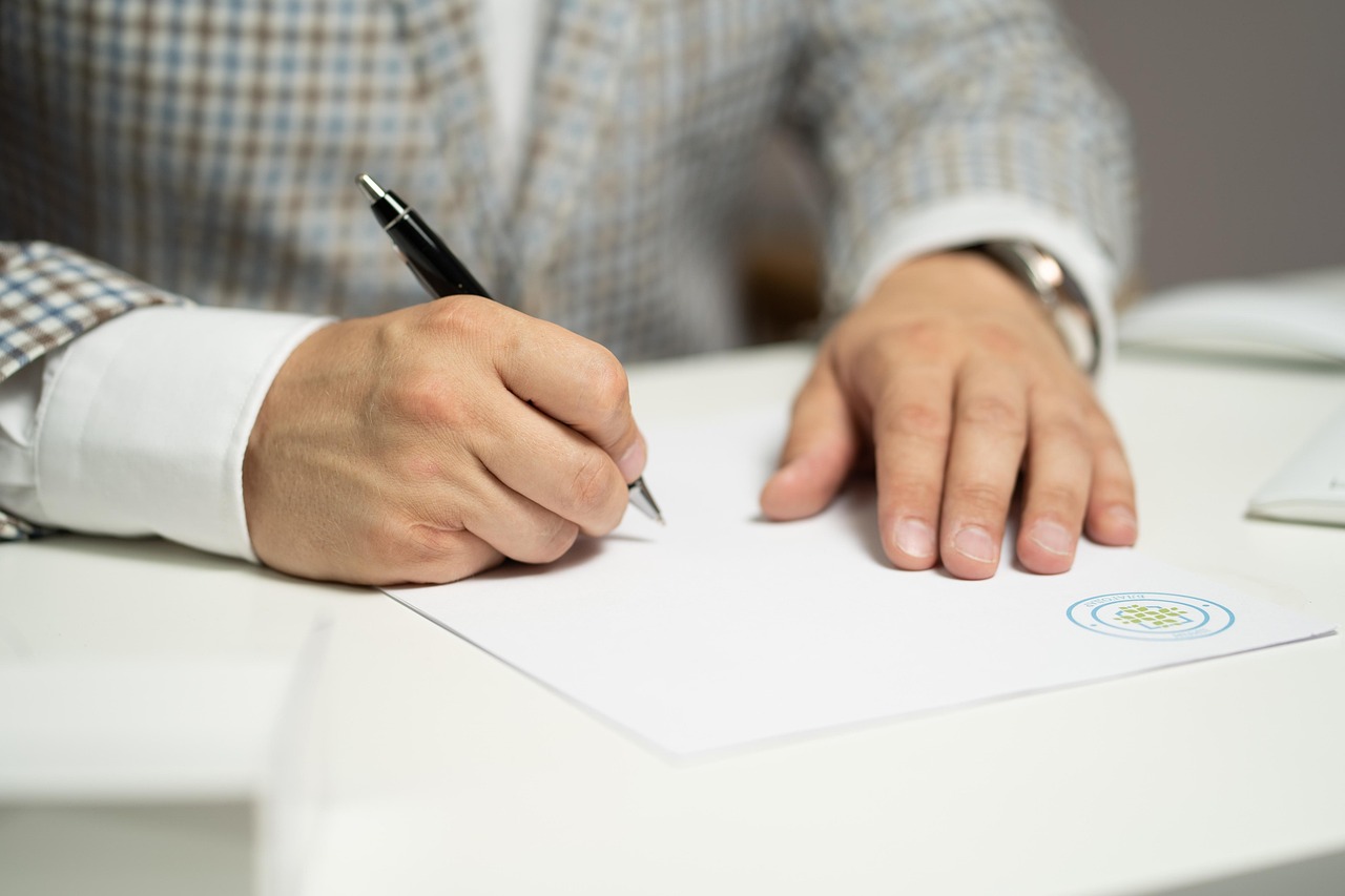 Business owner signing company registration documents